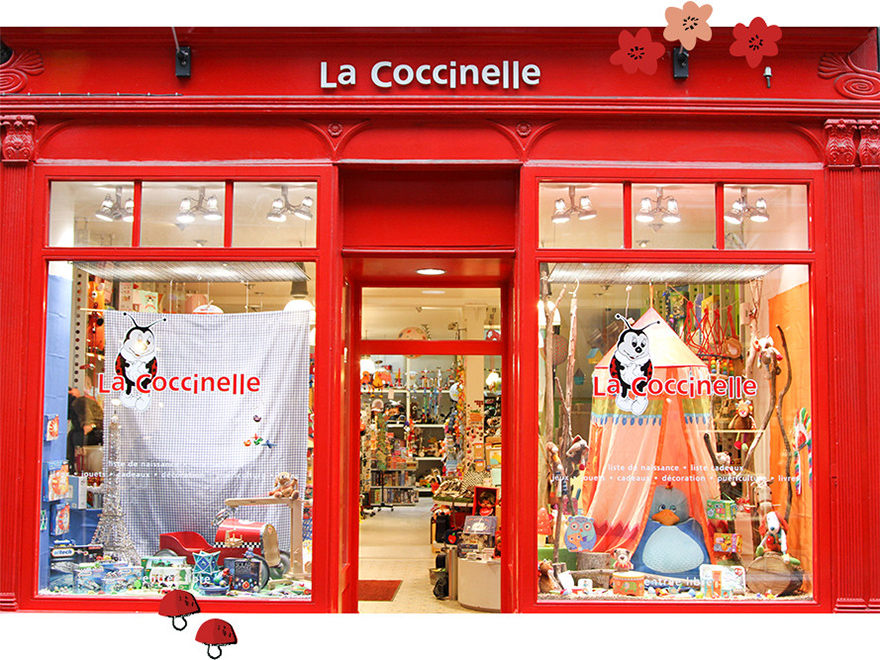 Devanture rouge de notre magasin La Coccinelle à Namur